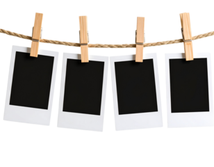 Four Polaroid-style photos clipped to a twine string with wooden clothespins isolated 