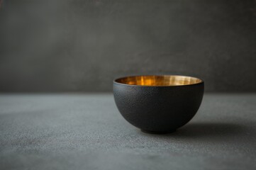 Minimalist Black Ceramic Bowl with Golden Interior An Elegant Piece of Home Decor
