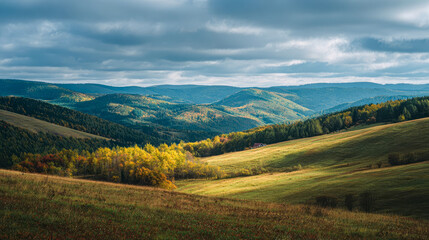 Obraz premium Mountain view in autumn, beautiful landscapes of hills under clouds