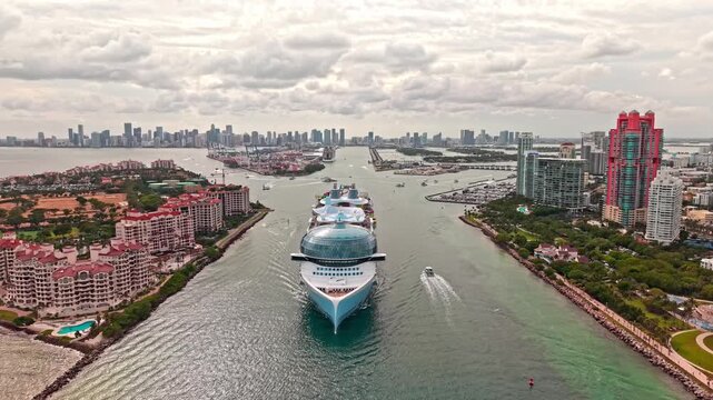 Aerial view of cruise in summer vacation. Cruise ship tour and travel at sea. Aerial view of luxury liner voyage. Ship leaving Miami beach port. Miami tour. Cruise ship voyage. Embark on a journey