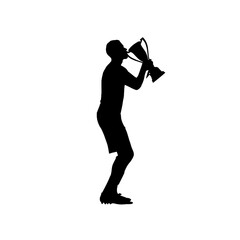 A silhouette of a person kissing a trophy.