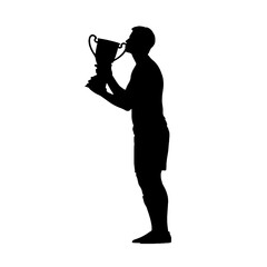 Silhouette of a champion celebrating his victory with a trophy.