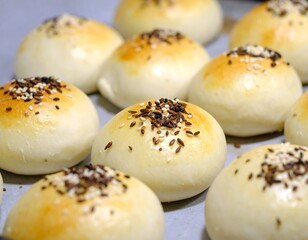 Freshly baked buns on a baking sheet