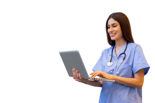 Smiling healthcare worker in blue scrubs typing on laptop, stethoscope draped around neck, isolated background