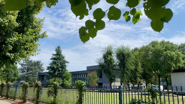 Italian Lyceum and Airplane Flyover &ndash; Urban Moment in Italy. San Donato Milanese, Milan, Italy.
