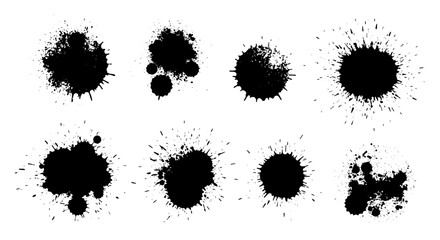 Black paint splatters in various shapes on white background  