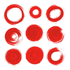 Red brush stroke circles in various sizes on white background  
