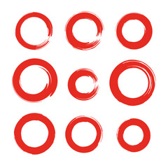 Red brush stroke circles in various sizes on white background  