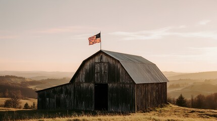 Old wooden barn with waving American flag