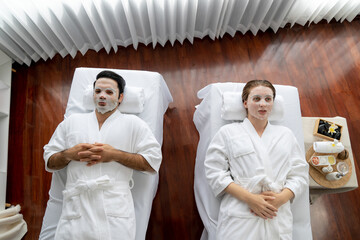 Serene modern daylight ambiance of spa salon, couple customer indulges in rejuvenating with facial...