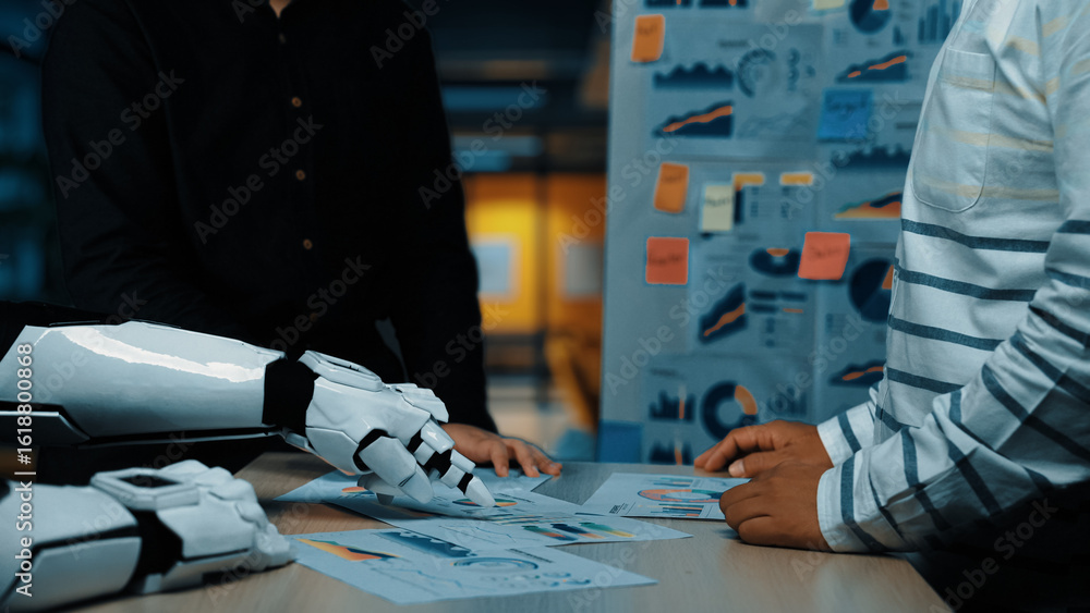 Aufkleber a human and a robotic arm engage in a collaborative discussion in a modern office, analyzing data ch
