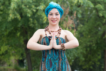Portrait of a beautiful woman. Woman with a turban on her head. Meditation.