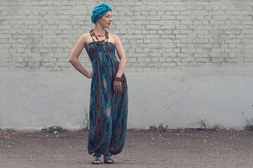 Portrait of a beautiful east woman. Woman with a turban on head.