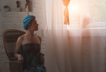 Portrait of a beautiful east woman. Woman with a turban on head.