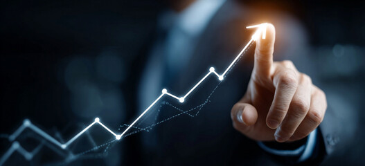 Businessman touching a glowing upward arrow graph symbolizing business growth, success, and financial progress

