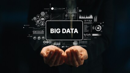 Hands Holding Large Text Displaying Big Data Surrounded by Digital Graphs and Icons Representing Analytics and Technology Concepts. Asymptotic smart data analytic.