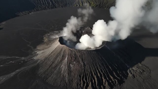 An aweinspiring aerial view of a volcano crater emitting smoke, showcasing the raw power and geological activity of nature, inviting viewers to witness the earths dynamic forces