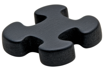 A black puzzle piece with a unique shape, featuring rounded edges and a matte finish.