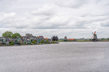 Rural landscape with windmill in Zaanse Schans. Holland, Netherlands. Authentic Zaandam mill....
