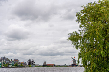 Rural landscape with windmill in Zaanse Schans. Holland, Netherlands. Authentic Zaandam mill....