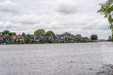 Rural landscape with windmill in Zaanse Schans. Holland, Netherlands. Authentic Zaandam mill....
