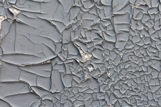 texture of old wall.Old cracked wall, vintage background,grunge vintage texture. Grey retro background. Crack with flappy peeling edges.