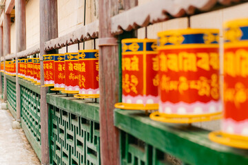 Close-up of many Tibetan prayer wheels spinning in slow motion, mongolia