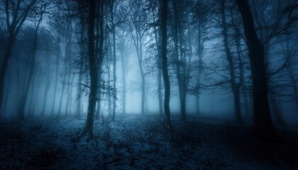 haunting blue forest with bare trees in eerie night fog perfect for horror cover or halloween background

