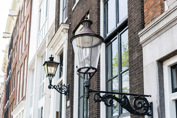 Details and facades of Amsterdam characteristic brick construction of residential building in Amsterdam School style. High quality photo