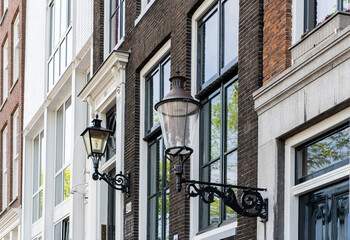 Details and facades of Amsterdam characteristic brick construction of residential building in Amsterdam School style. High quality photo