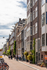 Details and facades of Amsterdam characteristic brick construction of residential building in Amsterdam School style. High quality photo