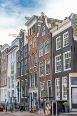 Details and facades of Amsterdam characteristic brick construction of residential building in Amsterdam School style. High quality photo