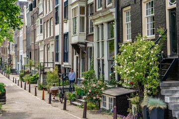 Details and facades of Amsterdam characteristic brick construction of residential building in Amsterdam School style. High quality photo