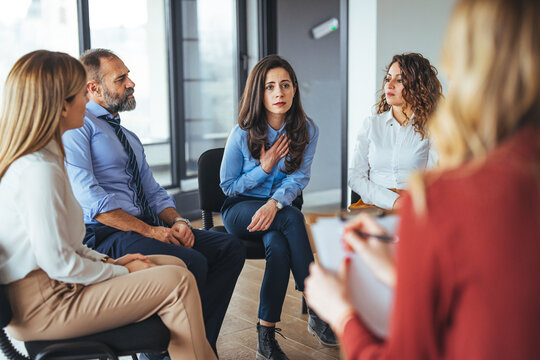 Support Group Discussion Among Coworkers in a Modern Office Setting