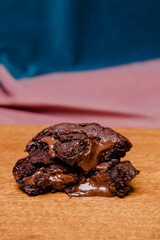 Decadent chocolate cookies with melted chocolate filling, stacked high. A delicious, sweet treat perfect for satisfying cravings.