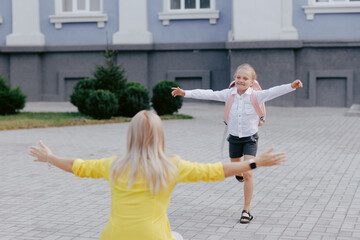 Girl Runs to Hug Mom on First Day Back to School, Family Reunion, Happy School Morning