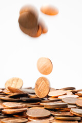 Pennies falling into a pile of pennies