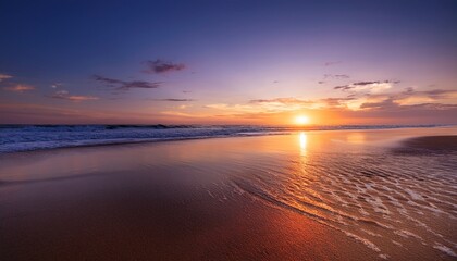 Obraz premium beach at sunset with its captivating beauty reveals blend of warm hues in evening sky shimmering reflection on water and tranquil ambiance of twilight evoking a sense of awe and wonder