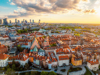 Fototapeta premium Warsaw old city center and skyscrapers in the background Vistula river. Sunset in Warsaw city center aerial view.