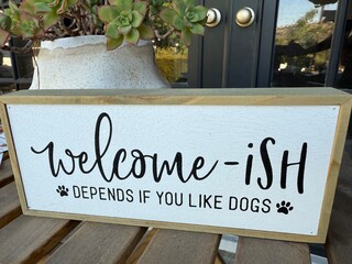 Welcome Sign with a Twist: Humorous home sign that says welcome—if you like dogs