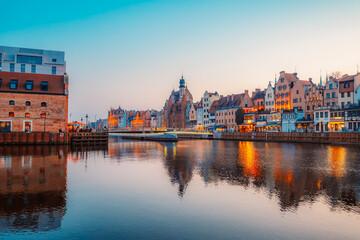 Gdansk with Motlawa river in Poland. Old town colourful house with Zuraw or crane and with Holy Spirit Gate