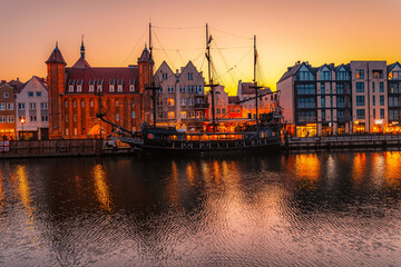 Obraz premium Gdansk with Motlawa river in Poland. Old town colourful house with Stragania Gate