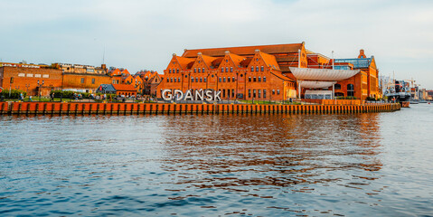 Gdansk with Motlawa river in Poland. Old town colourful house with Polish Baltic Frederic Chopin Philharmonic