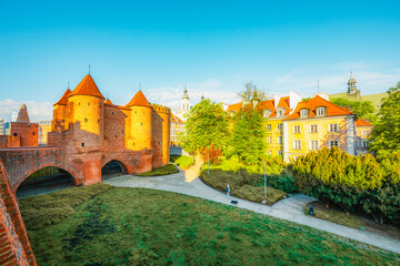 Warsaw old city center with Warsaw Barbican near Vistula river in the morning
