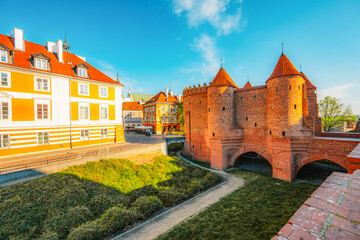 Warsaw old city center with Warsaw Barbican near Vistula river in the morning