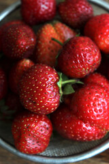 Strawberries in a sieve on a table