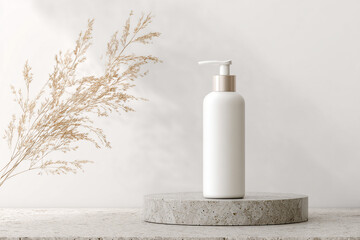 White cosmetic bottle with pump on a stone podium and dried grass