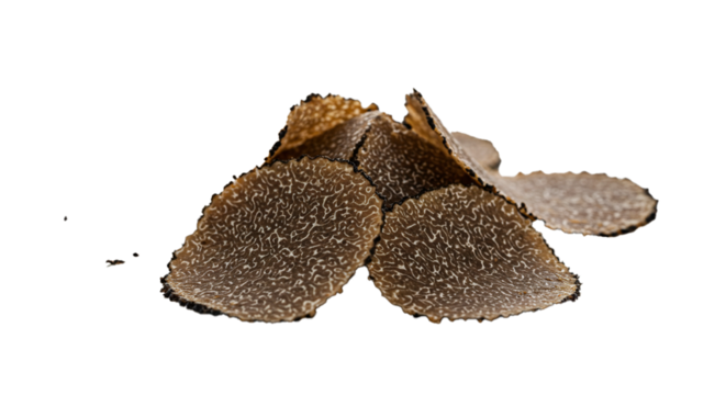 A small pile of sliced black truffles with a unique pattern on a black background in a studio shot on transparent background