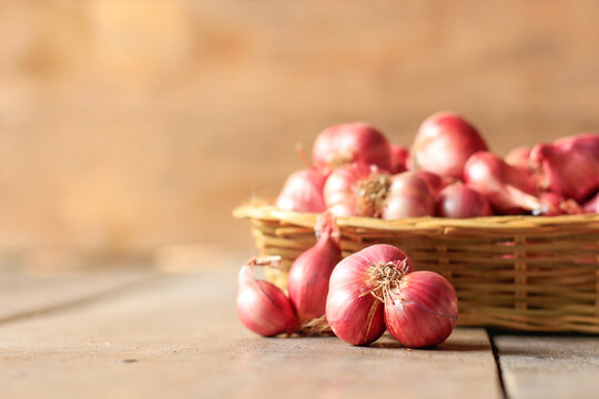 red onion on wooden table background