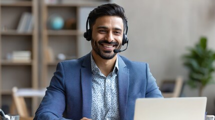Fototapeta na wymiar Indian business man professional employee, remote consultant, customer service support manager wearing headset talking at virtual meeting consulting client on video call at home office call center., 